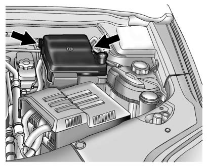 Chevrolet Equinox: Electrical System. To remove the fuse block cover, squeeze the clips on the cover and lift it straight
