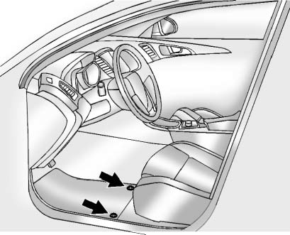 Chevrolet Equinox: Appearance Care. The driver side floor mat is held in place by two retainers.