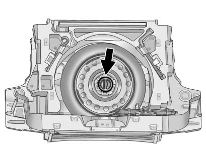 Chevrolet Equinox: Wheels and Tires. 4. Turn the retainer nut counterclockwise and remove the spare tire.